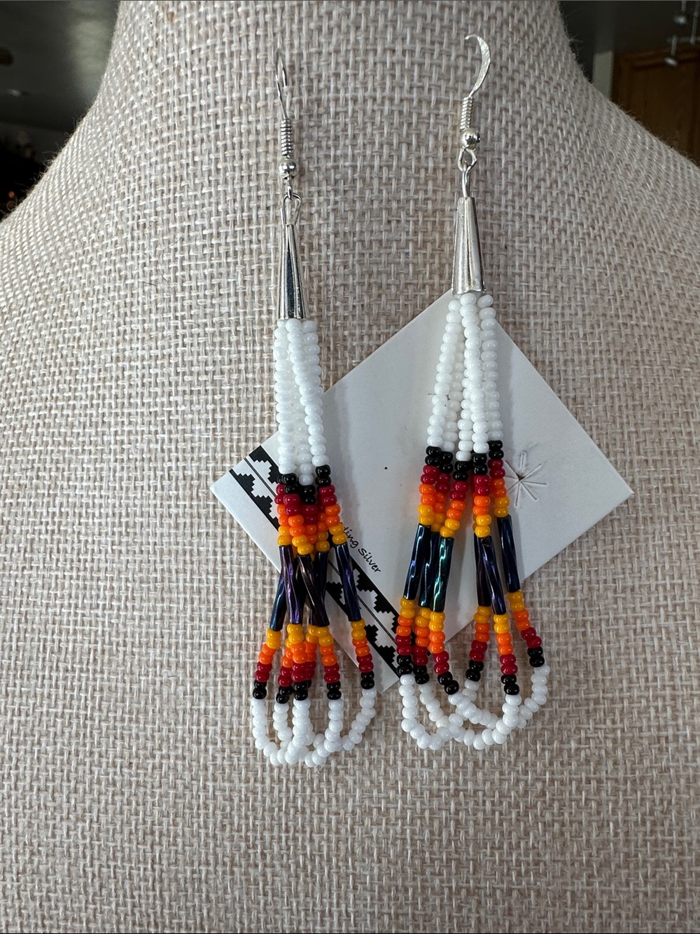 Indigenous White Beaded Earrings with Red Orange Yellow and Black Accents